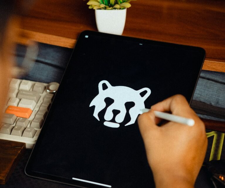 Designer drawing a logo on a tablet