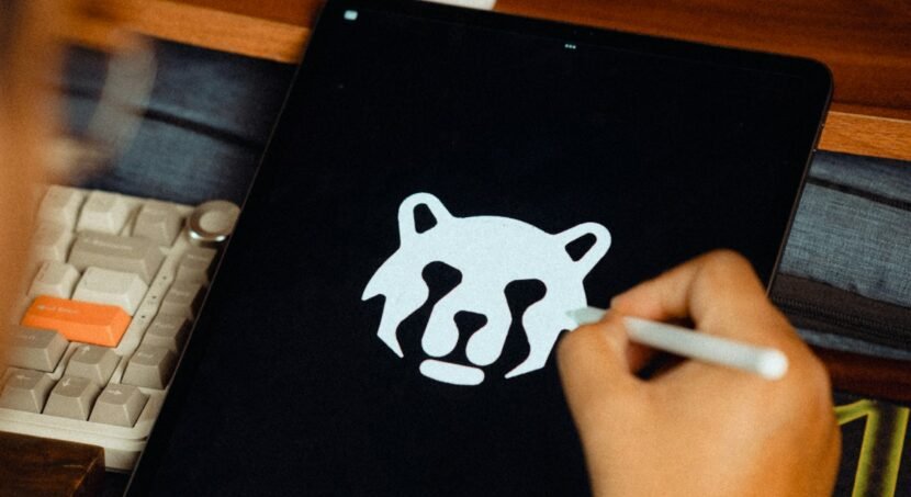 Designer drawing a logo on a tablet
